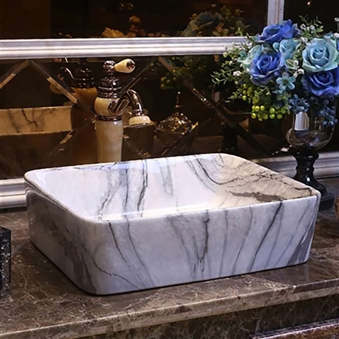BathSelect Hospitality rectangular black and white marble vanity sink with freestanding vintage faucet